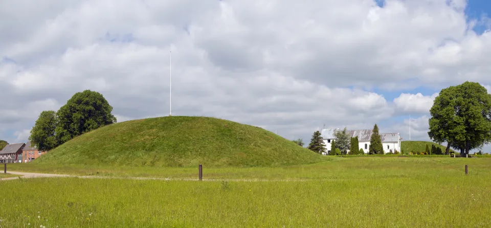 Southern Jelling Mound, southeast elevation with Church and Northern Mound in the background