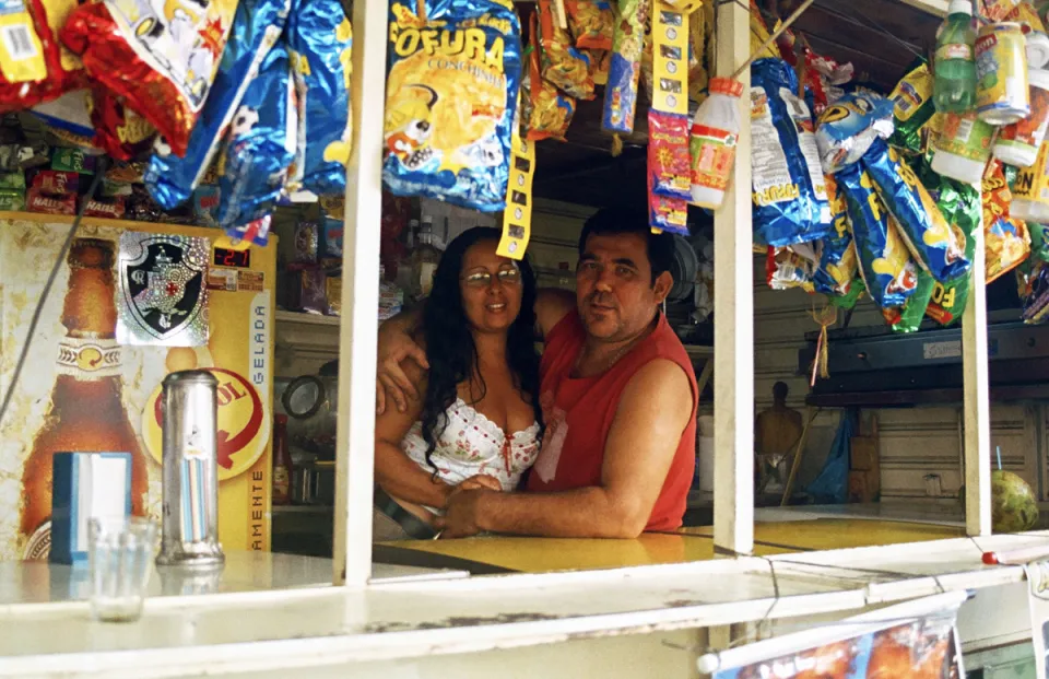 Kiosk owner with his daughter