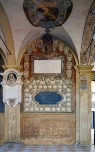 Archiginnasio Palace, coat of arms reliefs of the first floor arcade