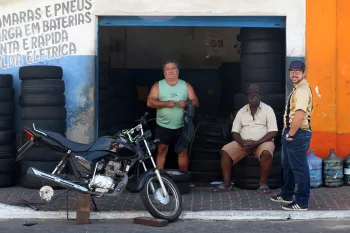 Mechanic and customers at a garage