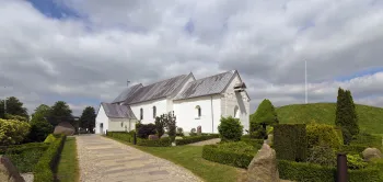 Church of Jelling, southeast elevation with Northern Jelling Mound on the right