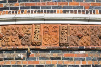 Holsten Gate, terracotta belt with heraldic eagle of the city