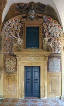 Archiginnasio Palace, first floor arcade with door and coat of arms reliefs