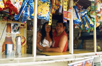 Kiosk owner with his daughter