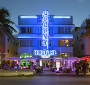 Colony Hotel, illuminated facade in the evening